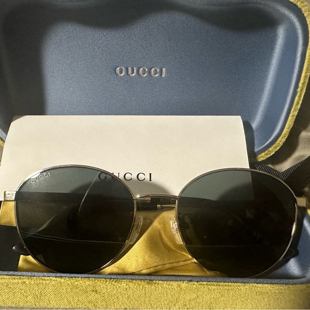 Authentic Gucci Sunglasses worn once and in pristine condition.